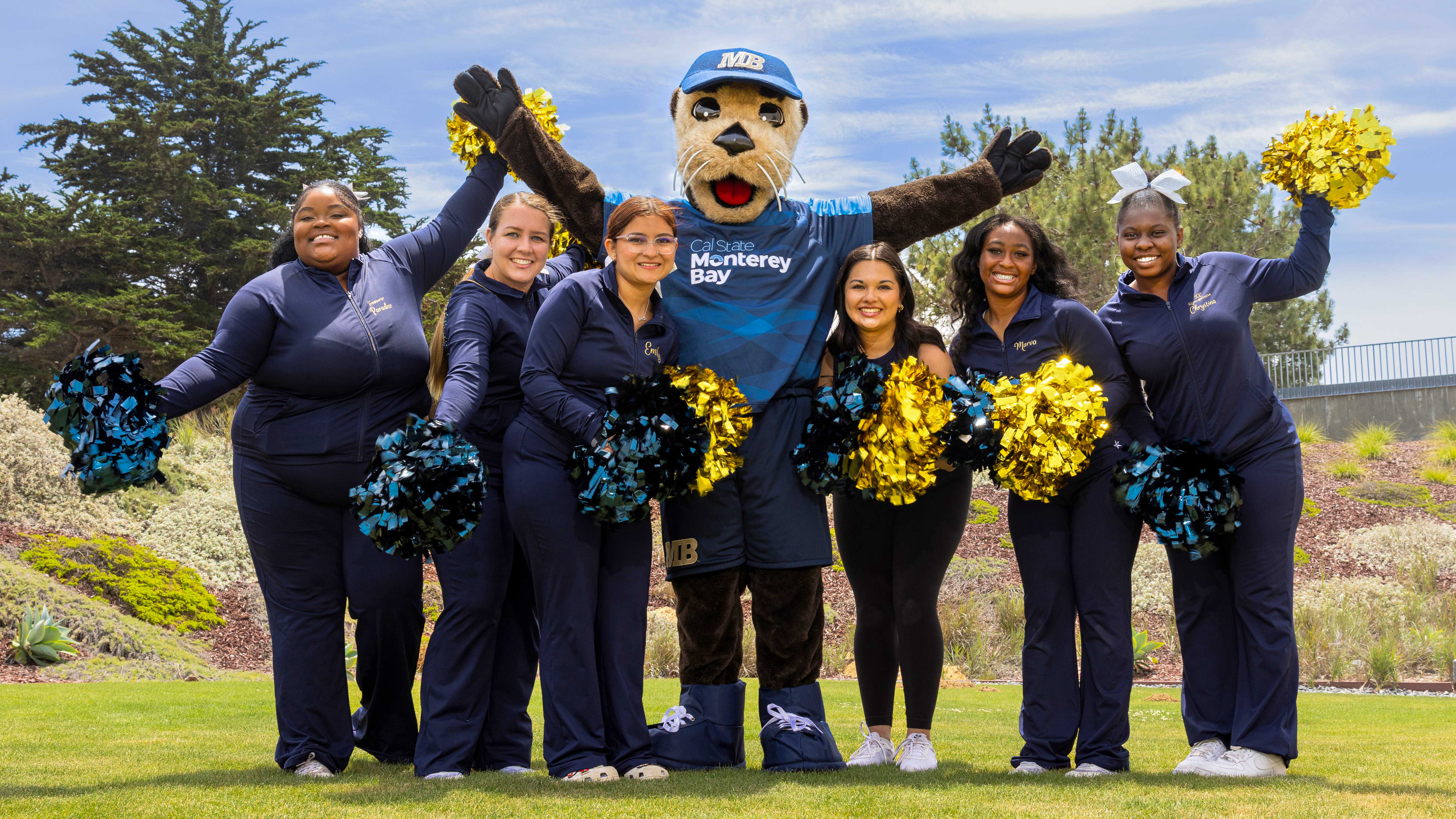 cheerleaders with the mascot cheering for birthday