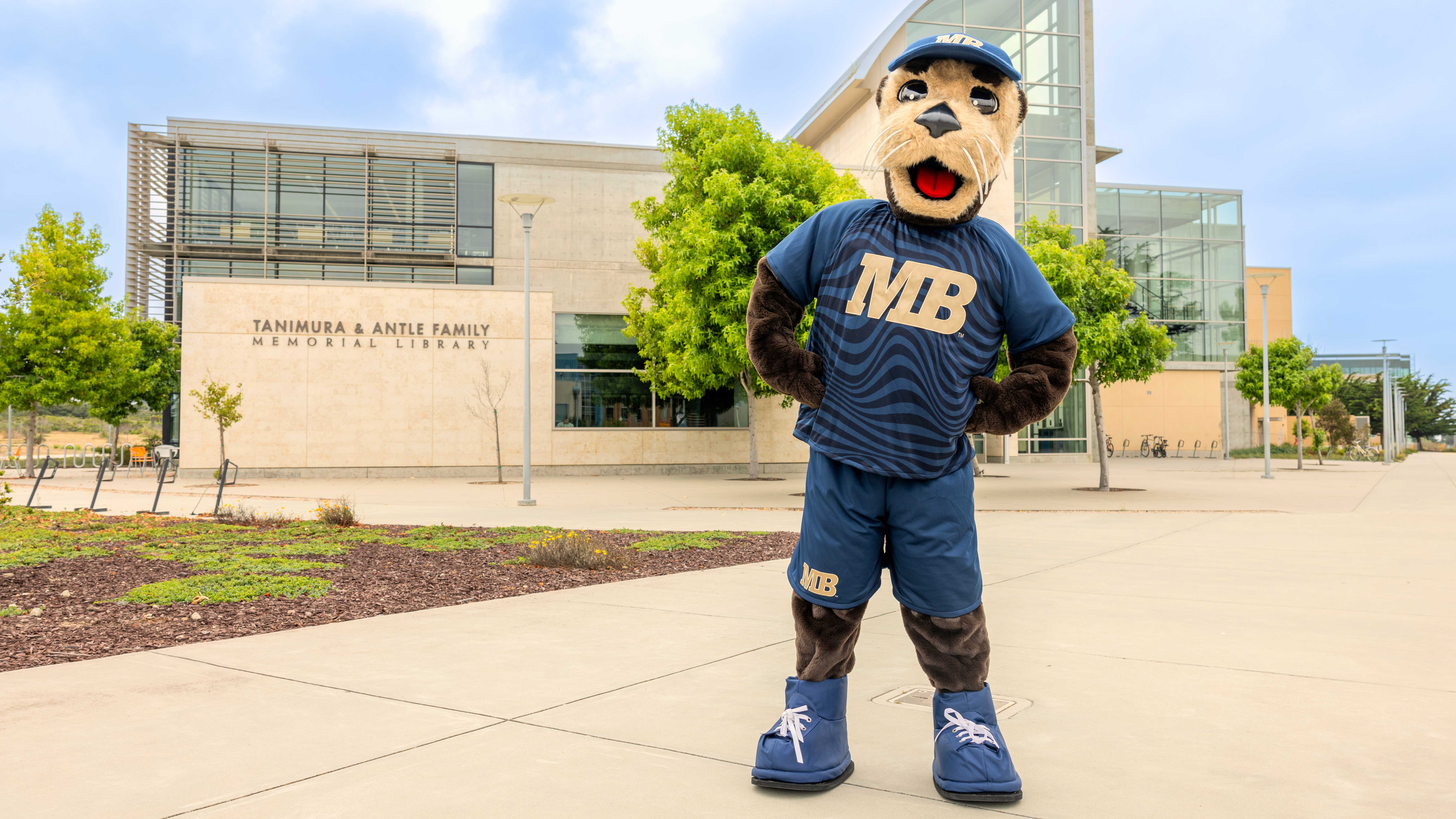 mascot infront of the campus  building