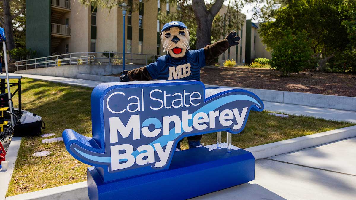 Mascot with a cal state Monterey By sign